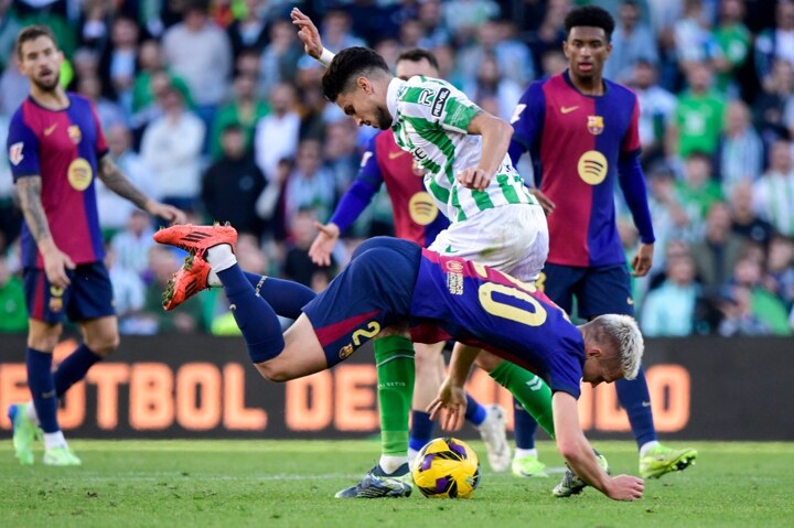 Barca star finds his TOOTH on the pitch after losing it in battle with defender