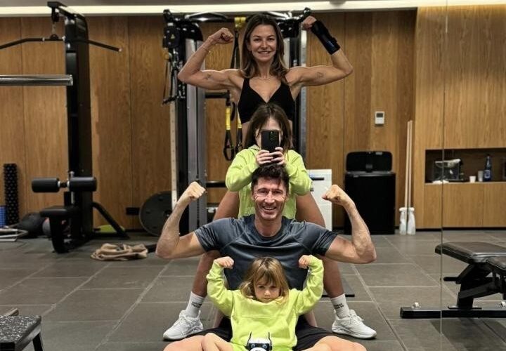 Lewy works out with his wife and two daughters at the gym during the Holiday