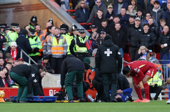 Ipswich star Wes Burns collapses to floor in agony and carried off on stretcher during Liverpool clash