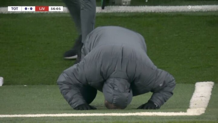 Ange Postecoglou falls to his knees in despair after Pedro Porro fails to convert golden chance against Liverpool