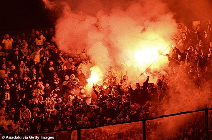 Istanbul derby is suspended after Fenerbahce fans ‘threw FLARES towards rivals’