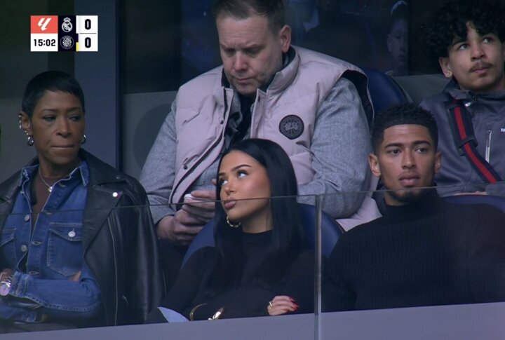 Bellingham’s girlfriend looks unimpressed as pair watch the game from stands