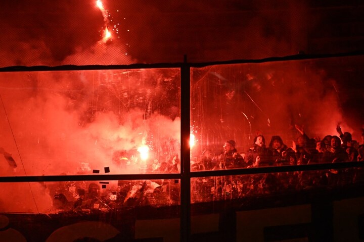 Istanbul derby SUSPENDED as Fenerbahce fans throw flares into Galatasaray end and police forced to intervene