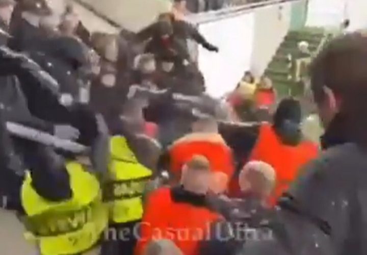 Notorious Ferencvaros ultras disguise themselves as STEWARDS to launch brawl