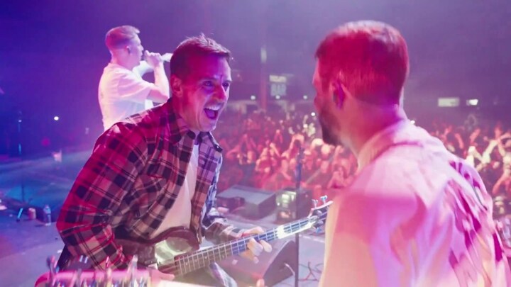 Incredible moment Gary Neville joins rock band on stage to play bass hours before being on Man Utd vs Arsenal comms